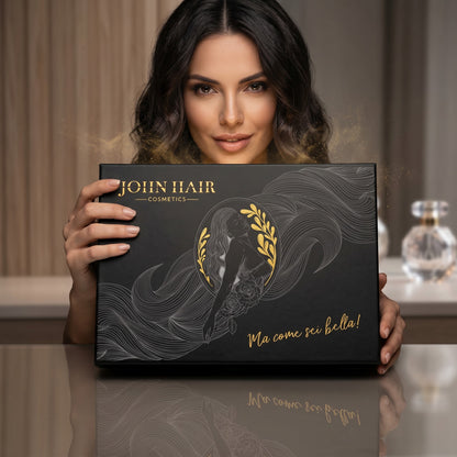 John Hair mystery box with elegant black and gold packaging held by a smiling woman in a beauty salon setting.